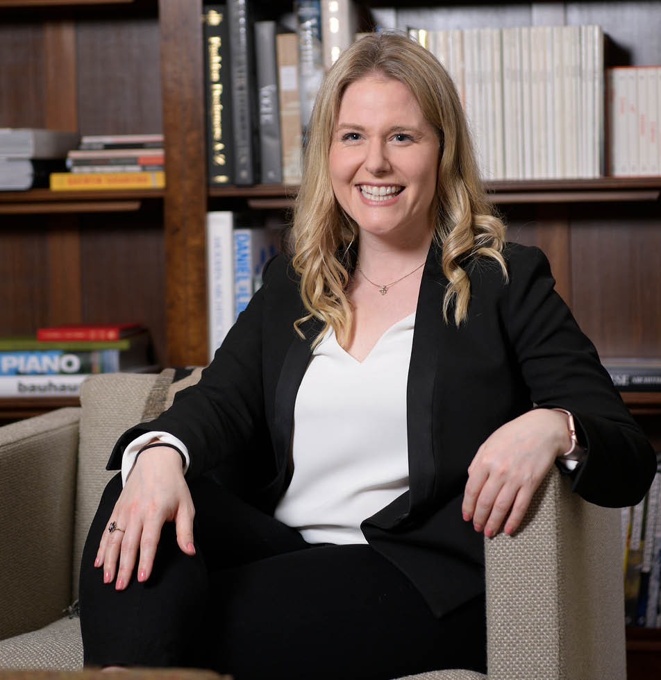 Woman sitting down smiling 