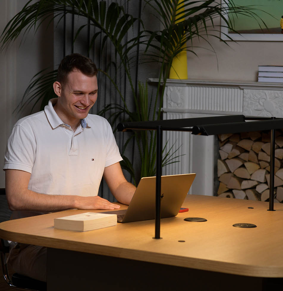 Man at laptop in warm light