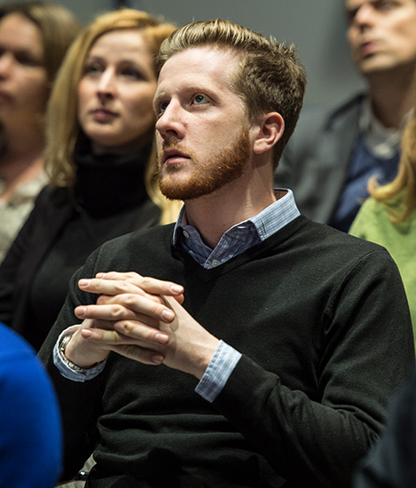 Man sat focused in a conference