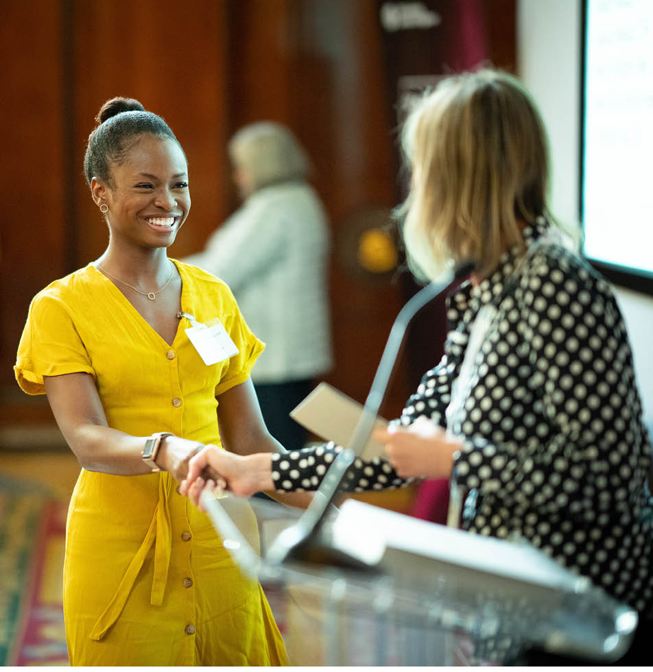 woman accepting certification