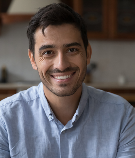 man smiling at a camera