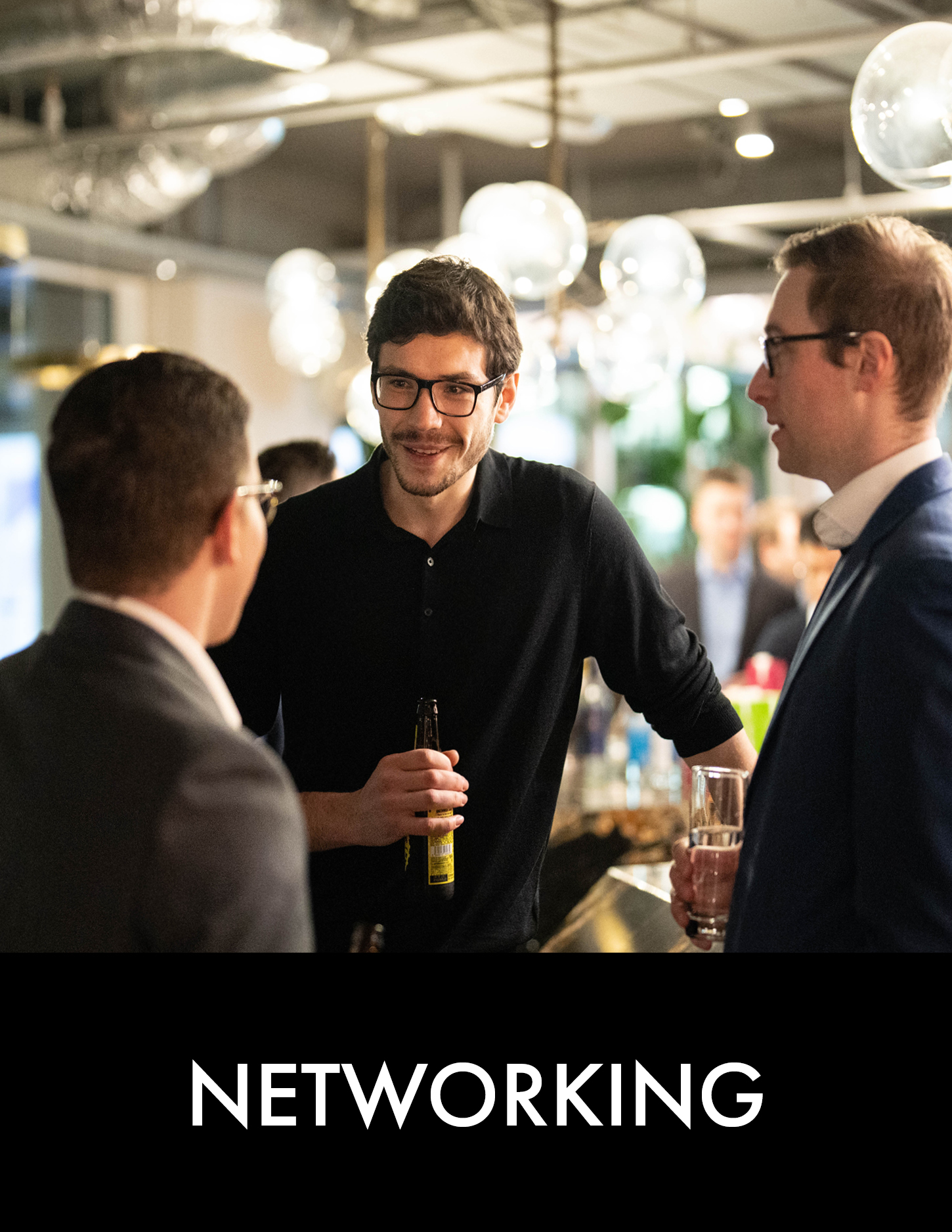 Three man talk at a bar