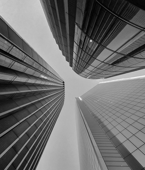 Upwards view of a sky scrapper in B&W