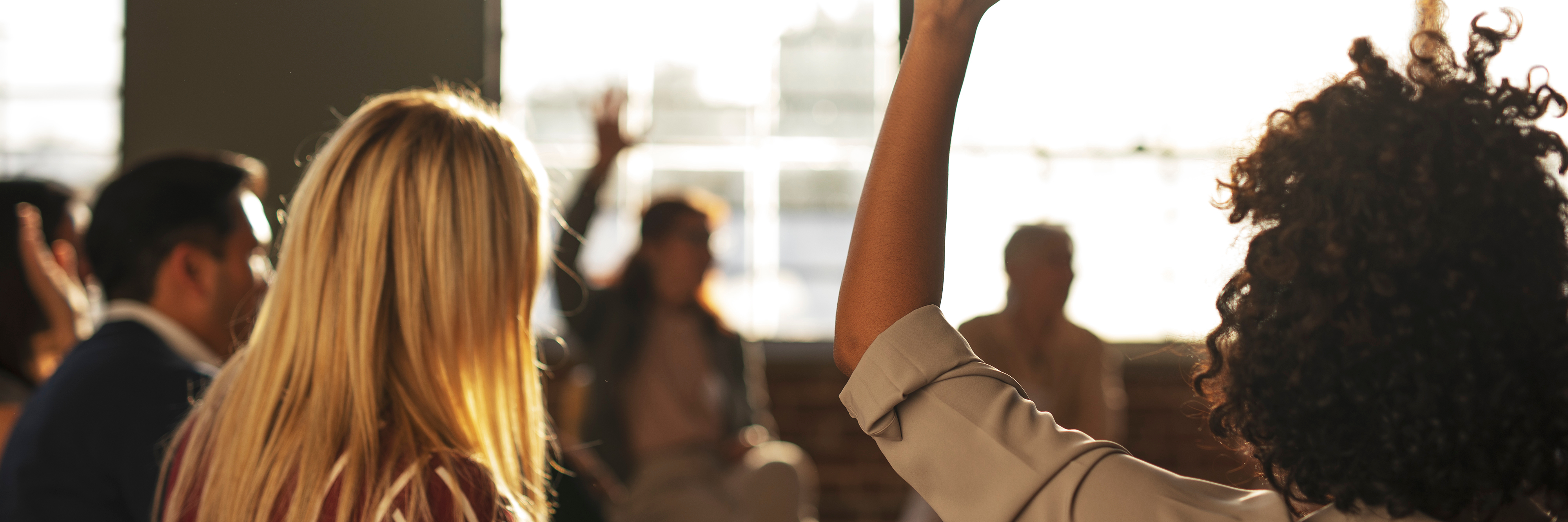 woman raising hand